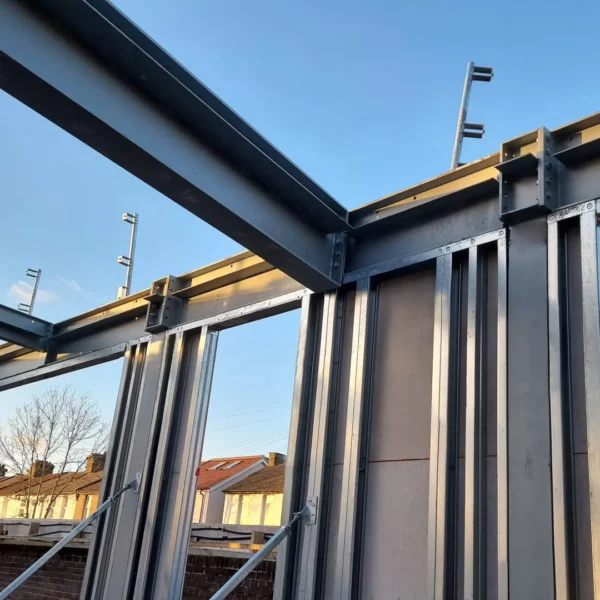 close-up-of-intrastack-steel-frame-on-abbey-wall-apartment-build